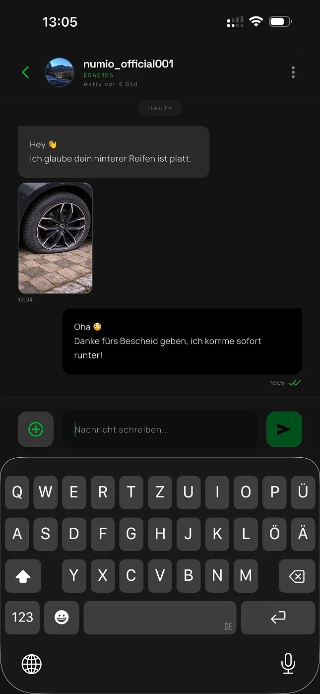 Anonymous chat in Numio: one user sends a photo to let another know their rear tyre is flat.